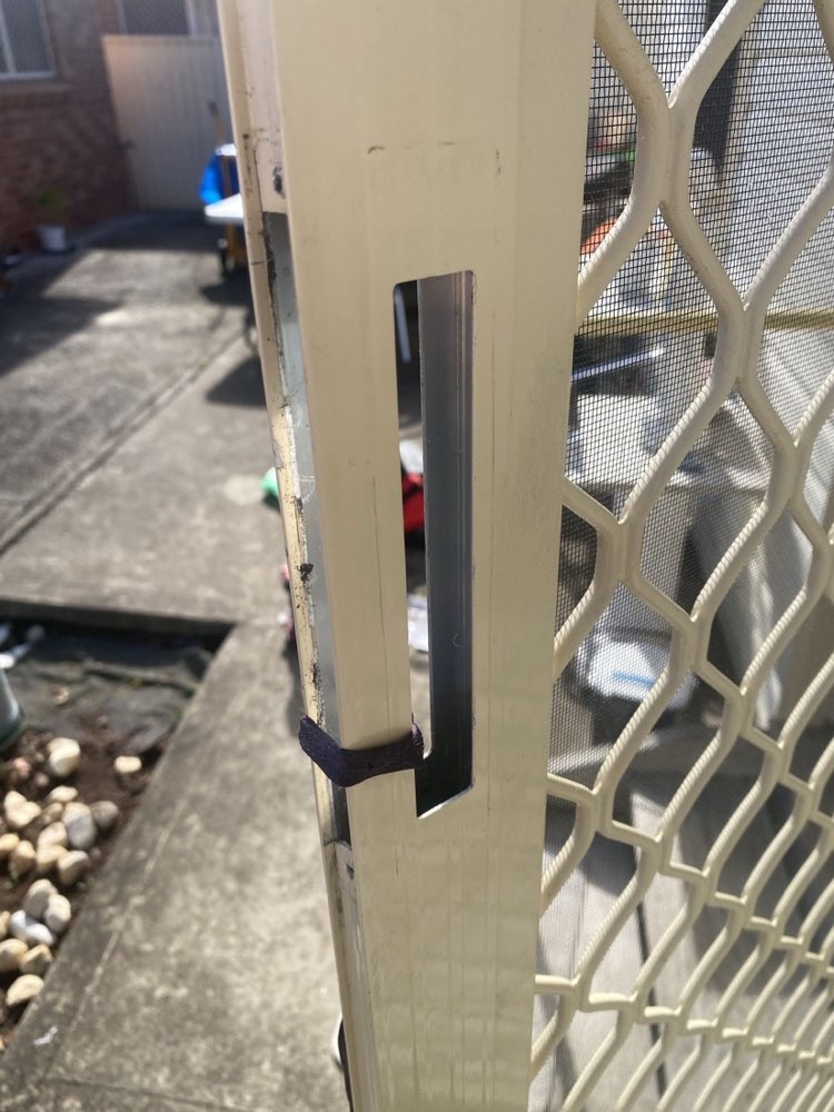 Security door with worn handle removed — before