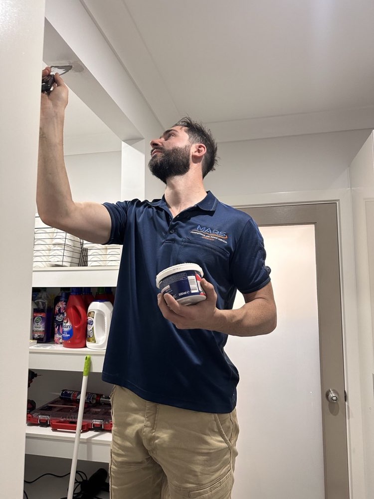 MARS Australia repairing a wall inside a home