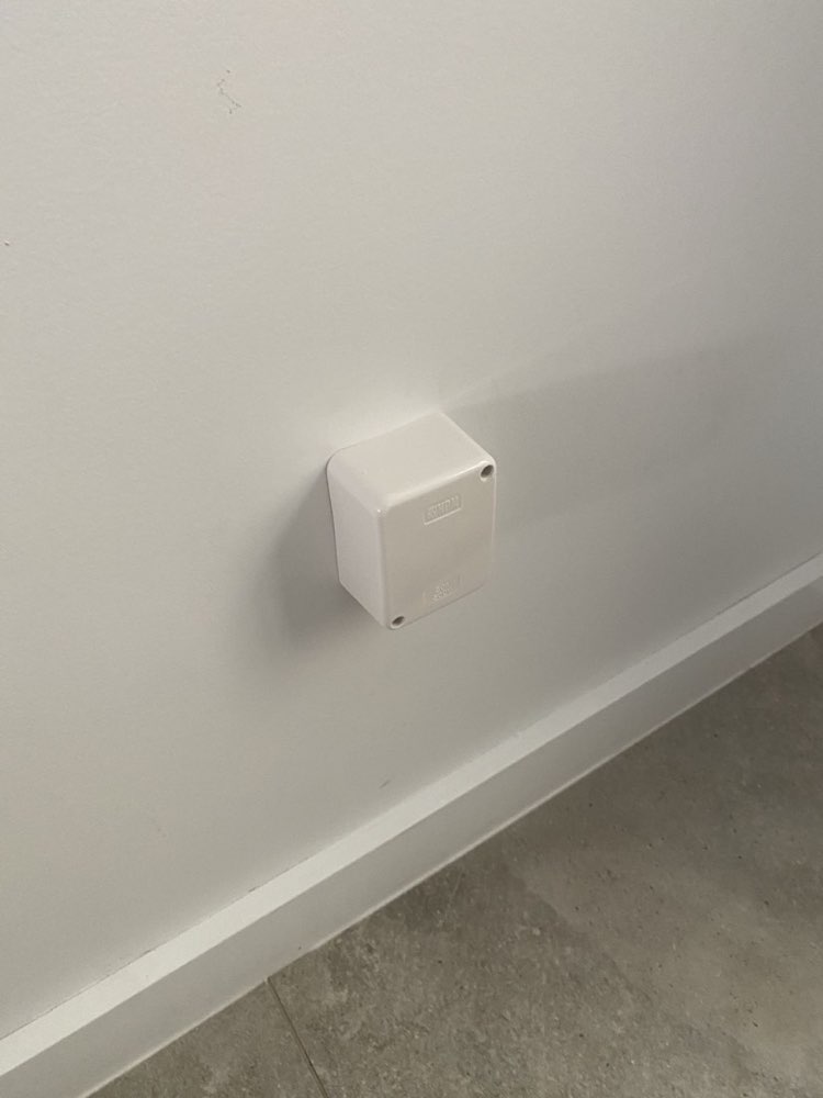 Capped outlet with a clean wall cover — after